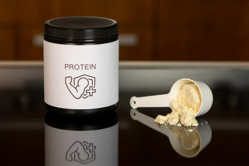 Supplement powder and measuring scoop - essential amino acids